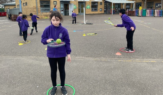 Year 4 Practice their Tennis Skills